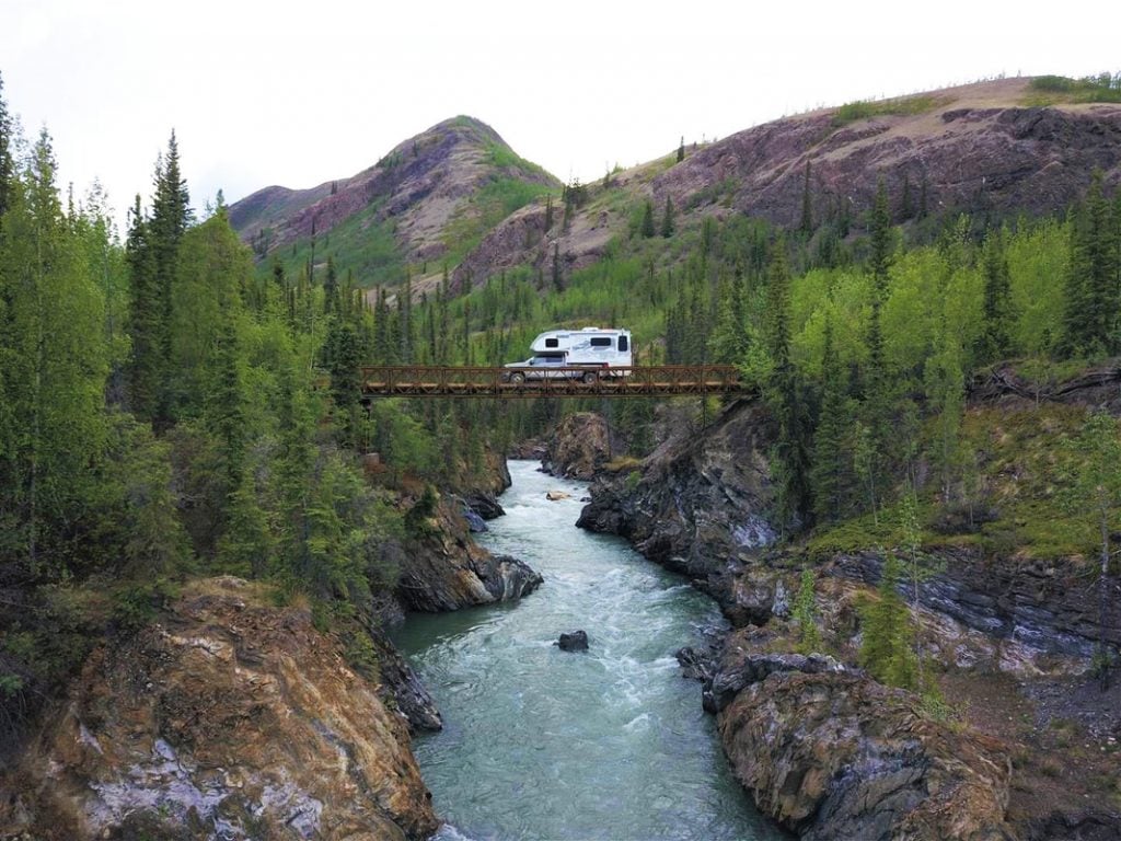 lance 1172 truck camper rv on bridge over river