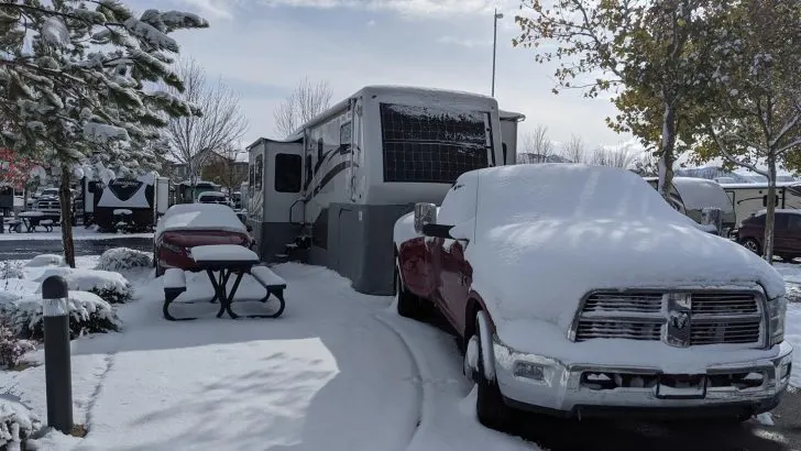 rv skirting on fifth wheel covered in snow