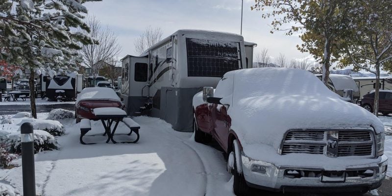 rv skirting on fifth wheel covered in snow