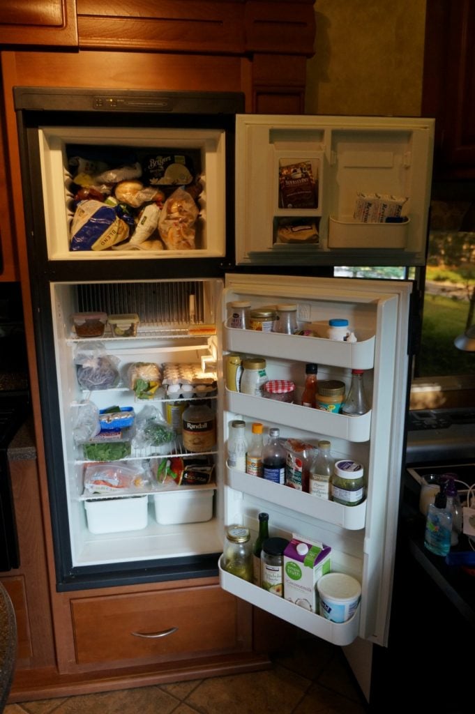 RV fridge open filled with food