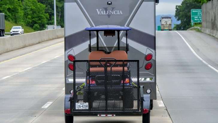 golf cart carrier behind motorhome rv