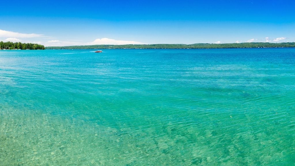 beautiful turquoise color of torch lake in michigan