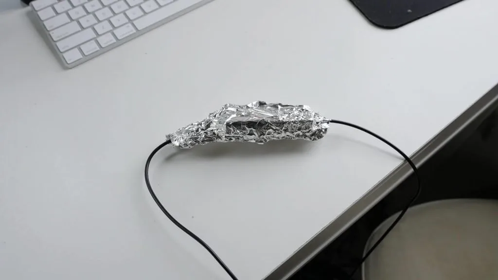 WeBoost internal antenna in aluminum foil to shield it from the booster's external portion
