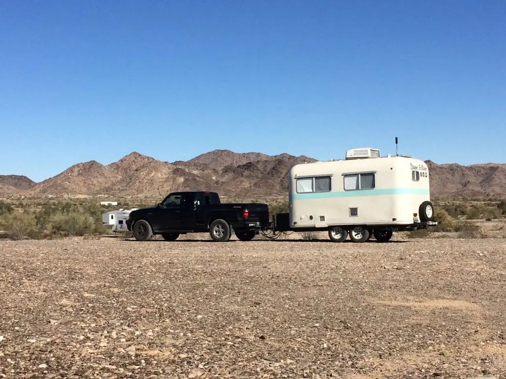truck towing small travel trailer RV