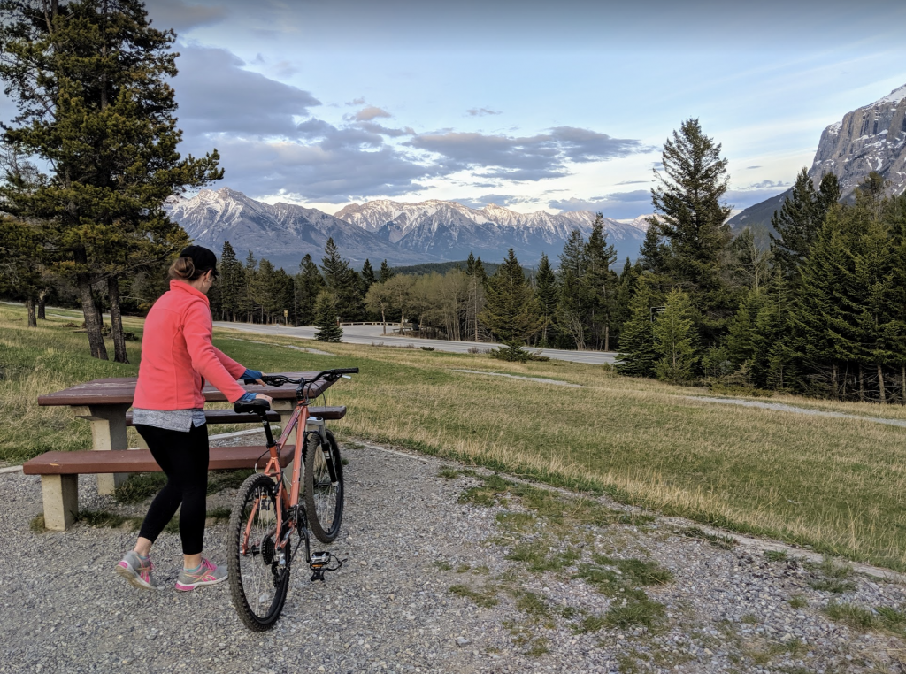 biking to gorgeous scenery with snow capped mountains