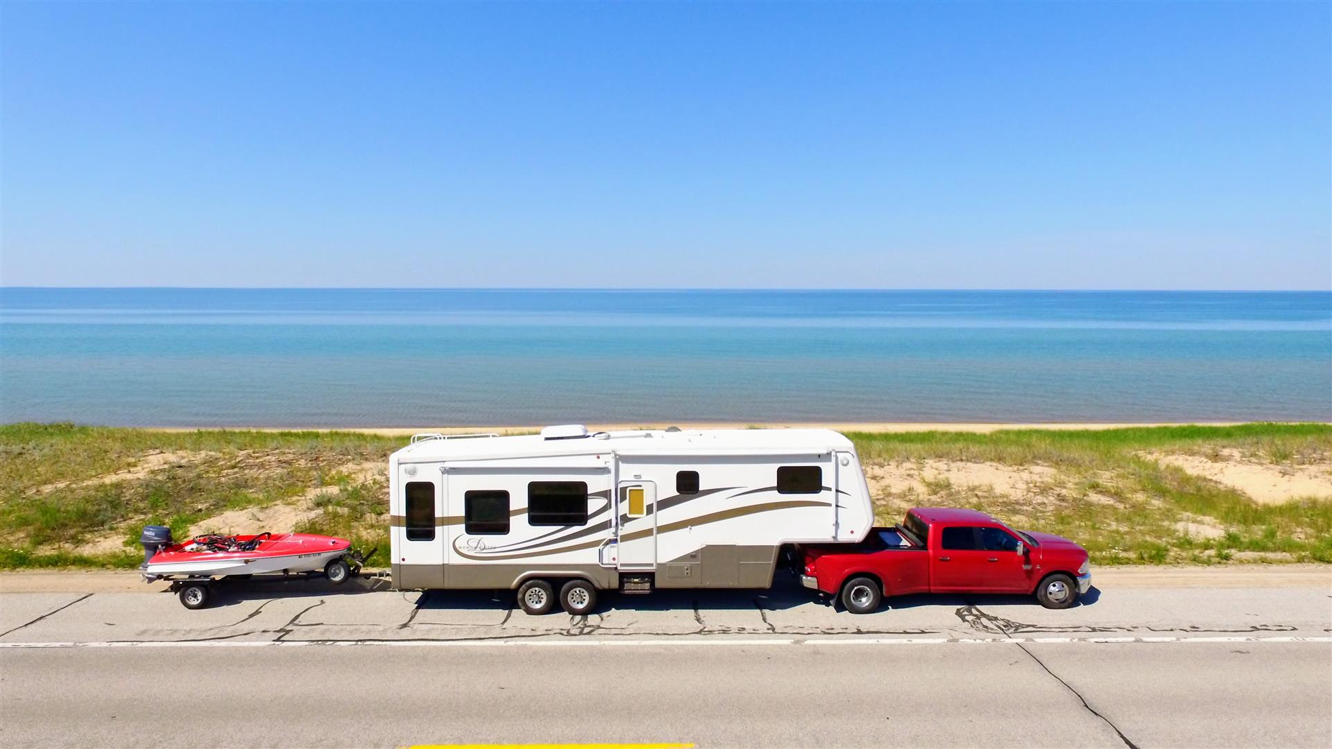 Triple towing a boat behind a fifth wheel