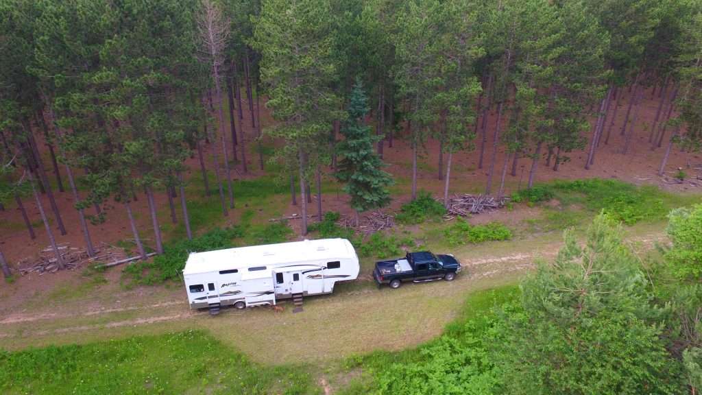 Aerial image of truck towing fifth wheel RV.