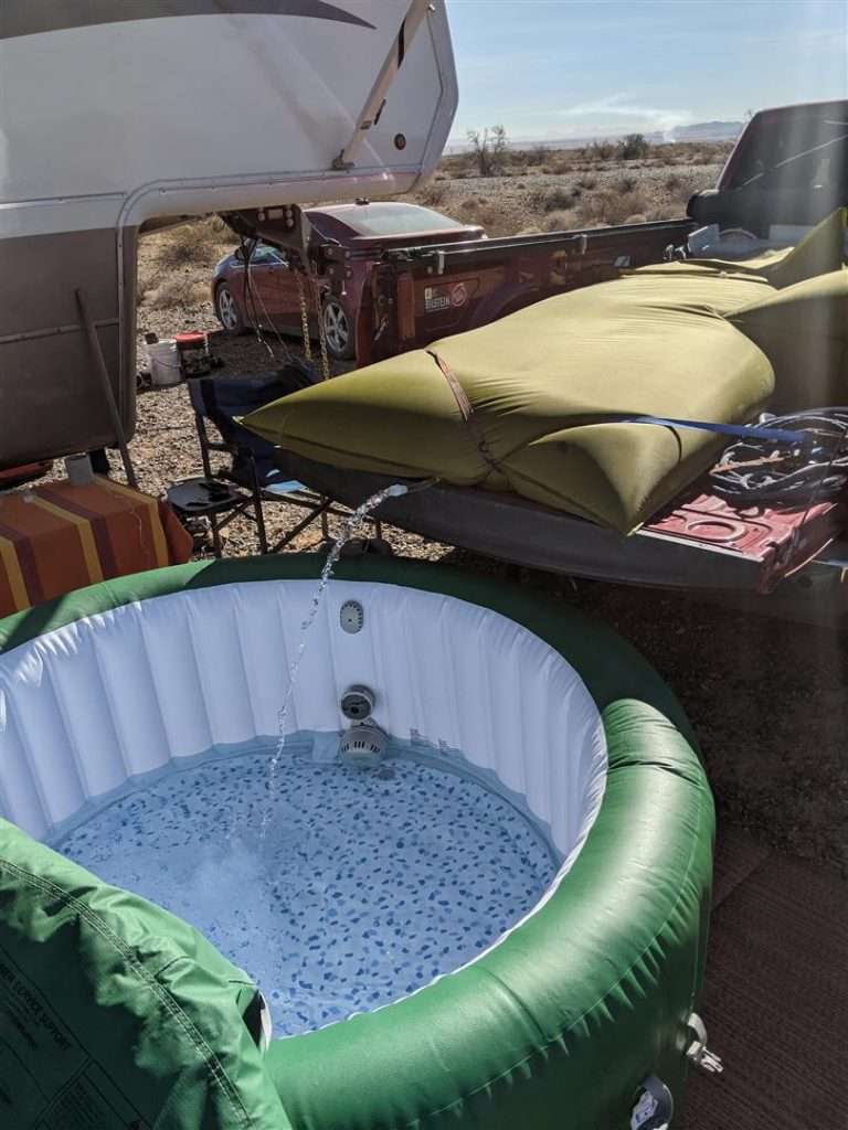 filling a portable hot tub with water bladder