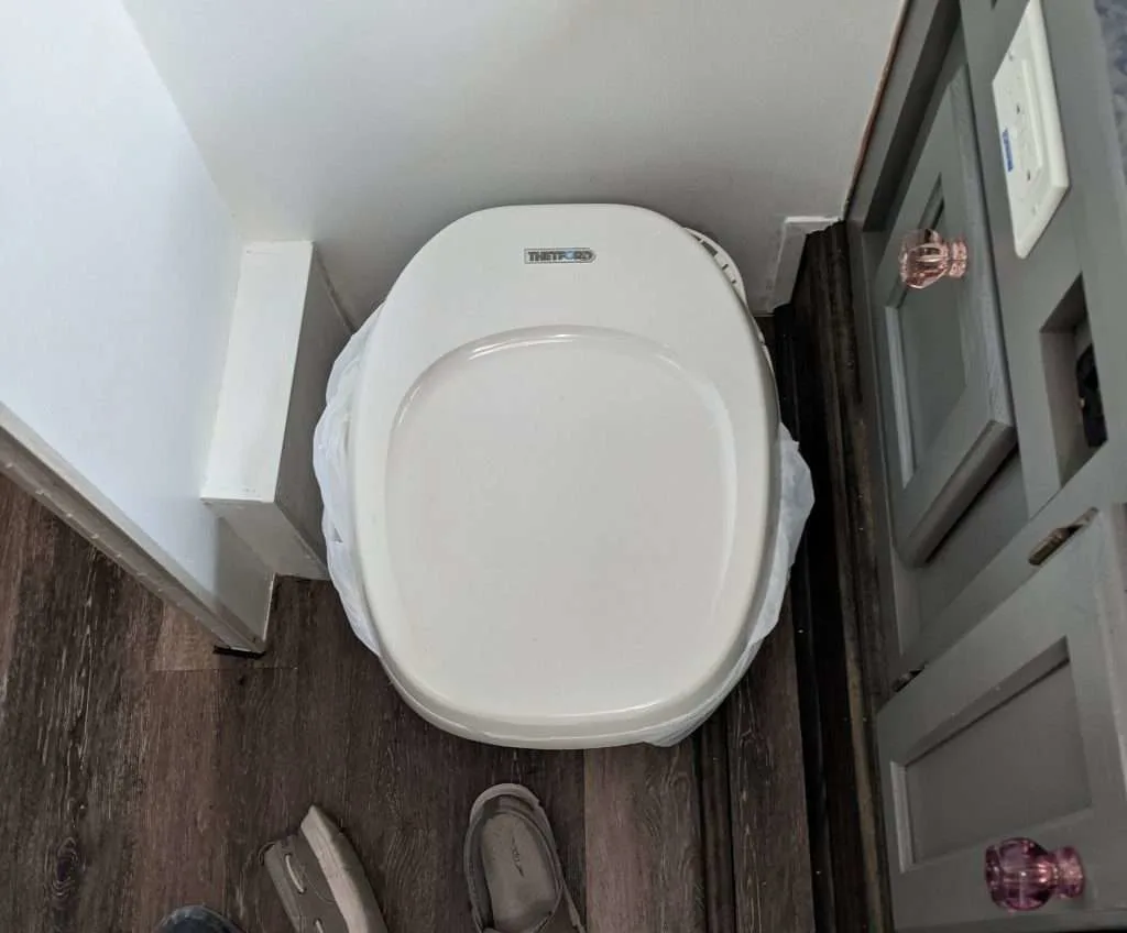 Overhead image of composting toilet in an RV.