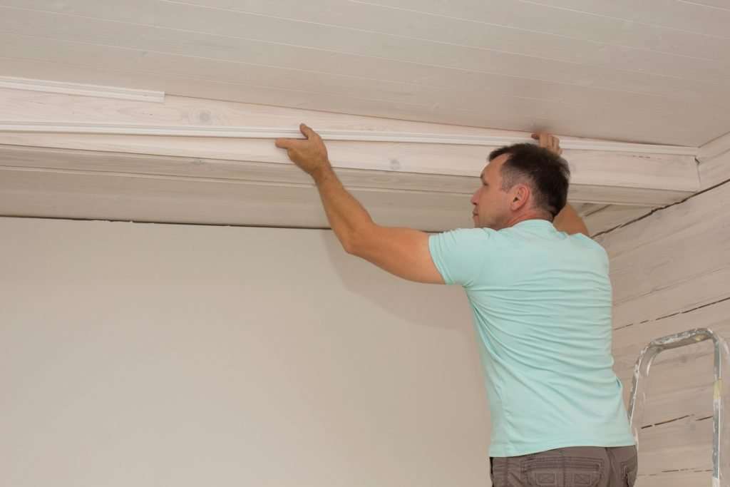 Man installing ceiling.