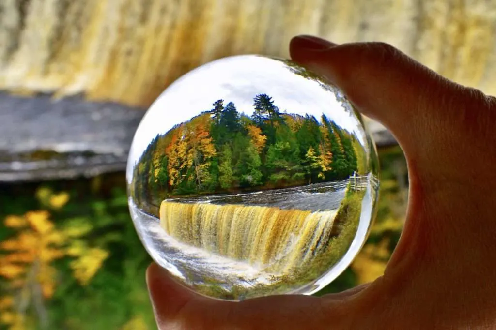 Tahquamenon Falls State Park waterfall through a glass orb.