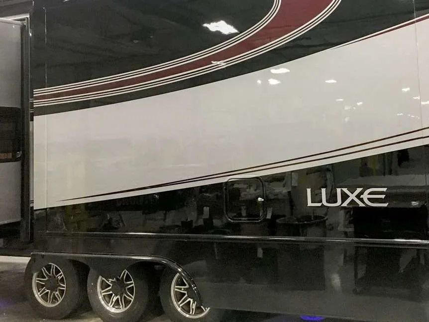 Exterior image of Luxe RV logo on side of 5th wheel.