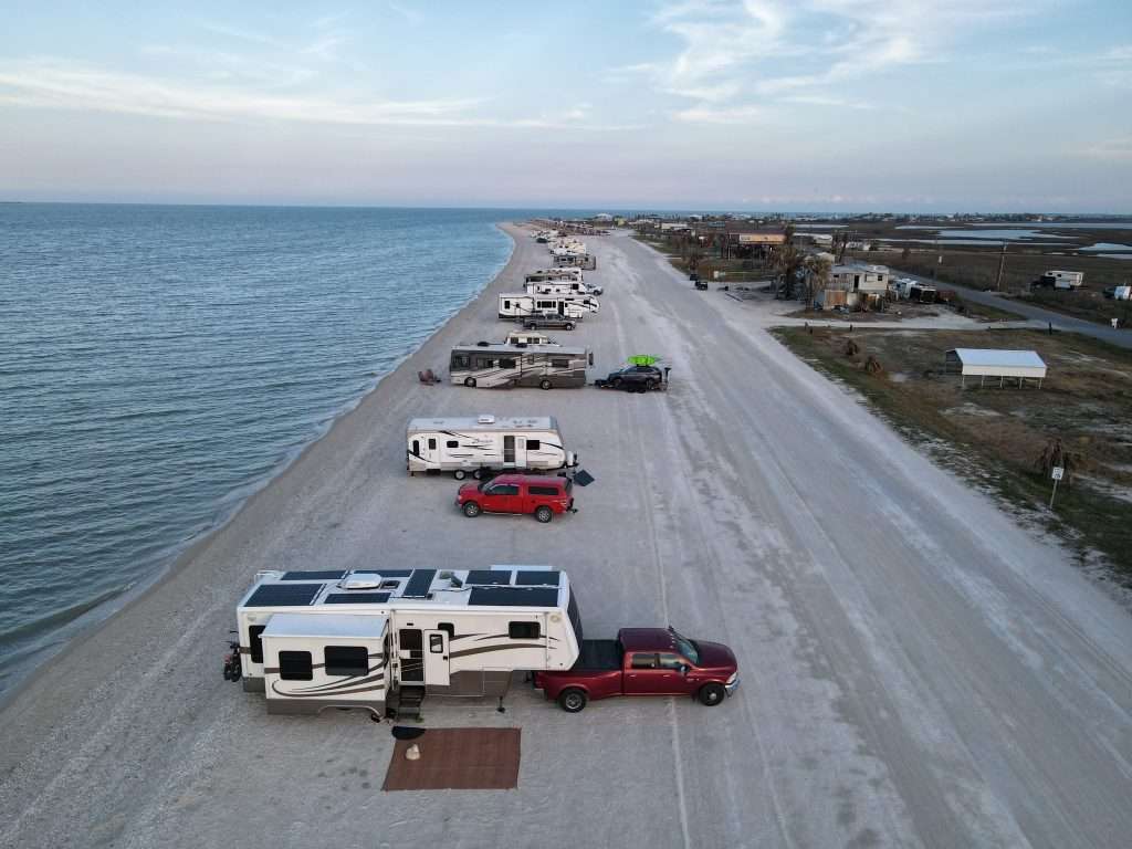 RVs parked along the beach in high humidity area.