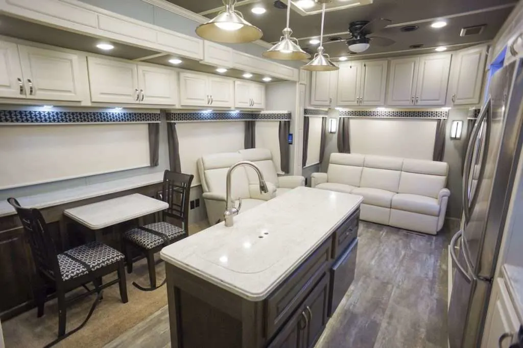 Interior image of kitchen and living room in Luxe RV.