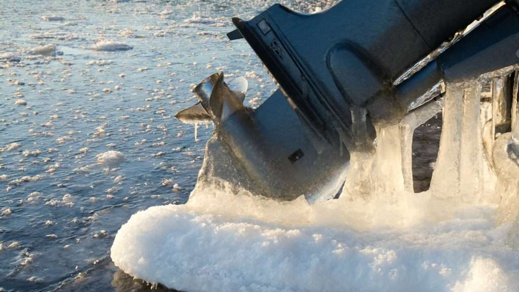 Outboard motor covered in ice