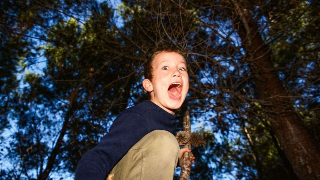 Frightened child in the woods 