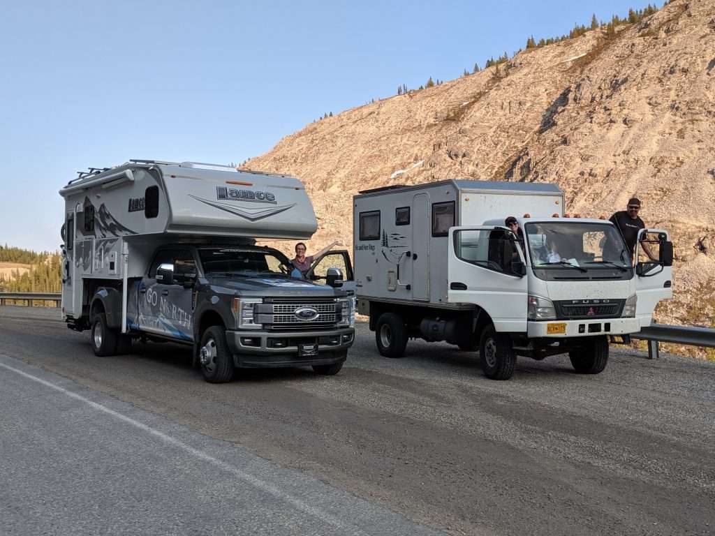 truck camper next to 4x4 rv