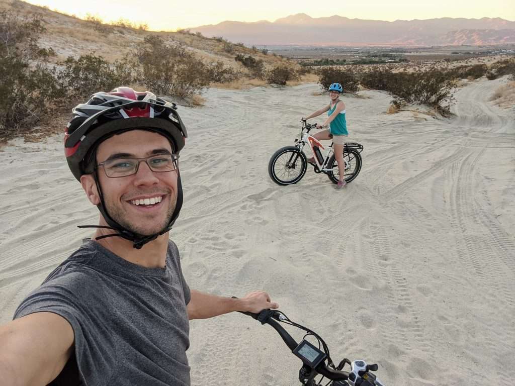 The Mortons biking on the beach