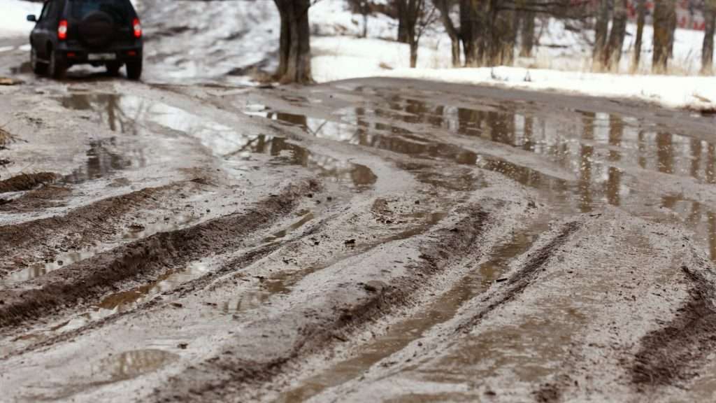 SUV on muddy road