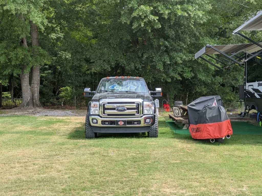 Ford truck parked at a campsite for towing a camper
