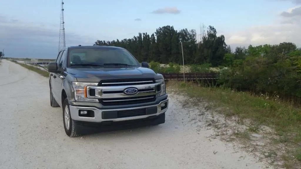 Ford F-150 parked in sand