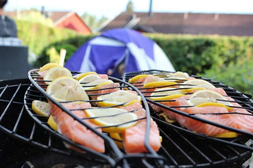 Lemon salmon cooking on the grill.