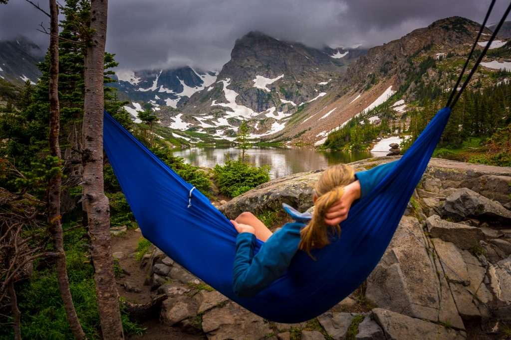 Woman relaxes on a hammock lake Isabelle Colorado