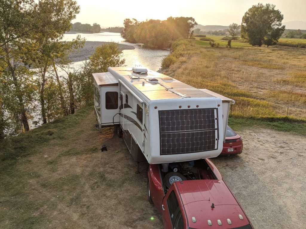 RV hitched to truck for towing.