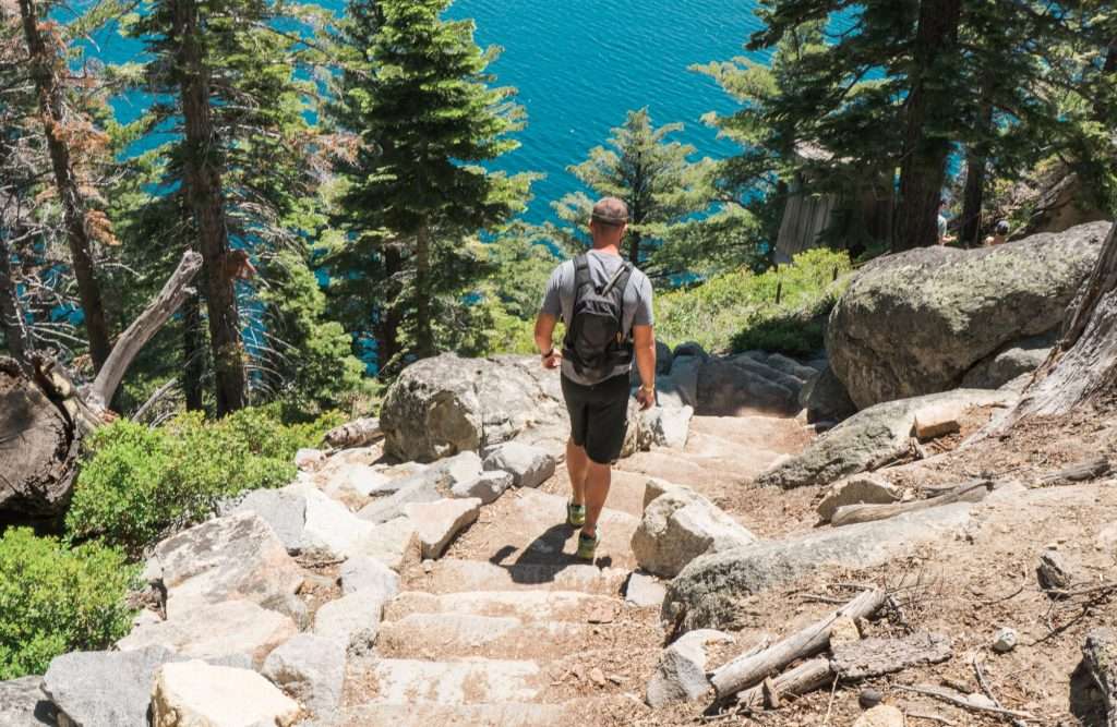 Man hiking next to Lake Tahoe.