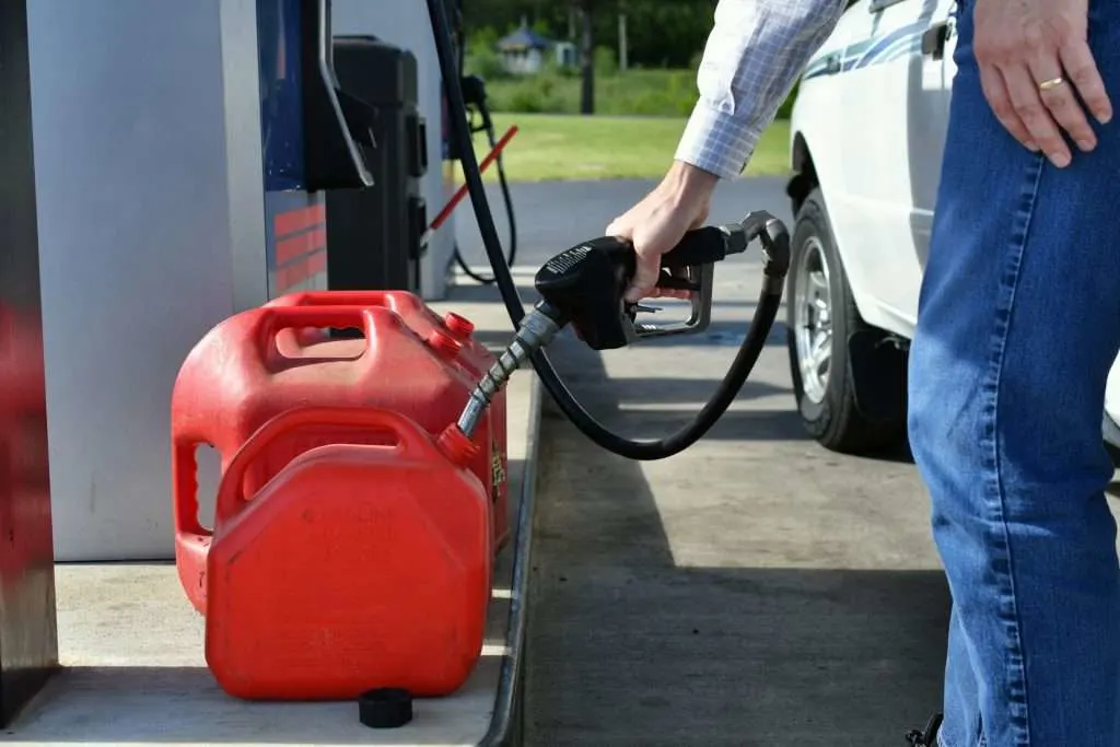 Man filling up gas cans.