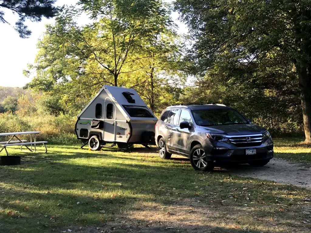 SUV attached to hard side pop-up camper