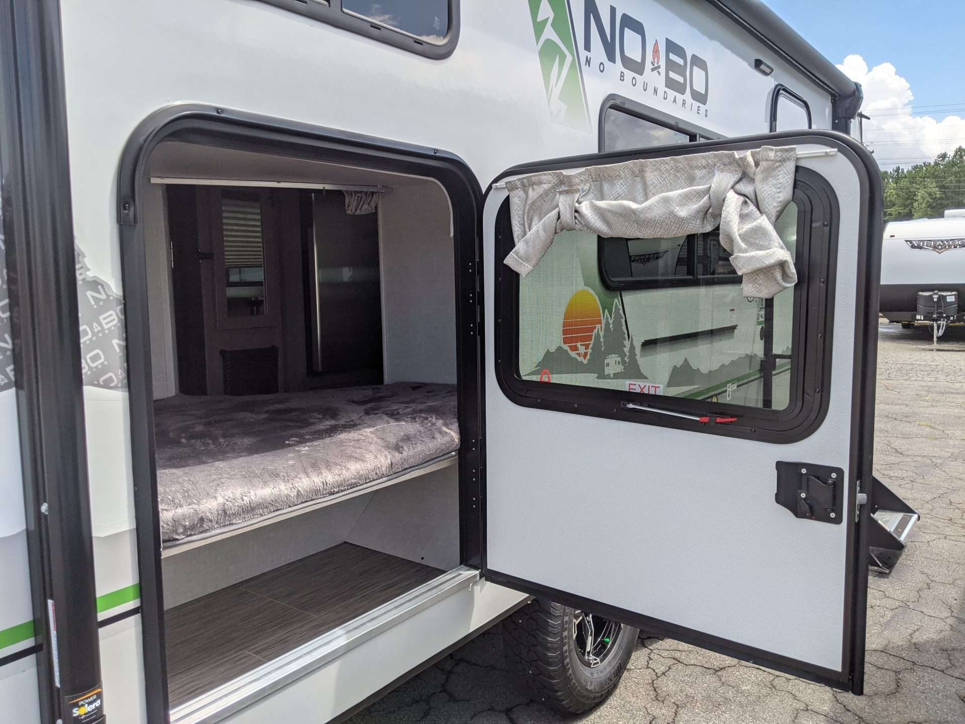 Nobo trailer bunk access door for storage