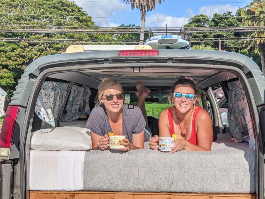 Rae and Cait hanging out in camper van