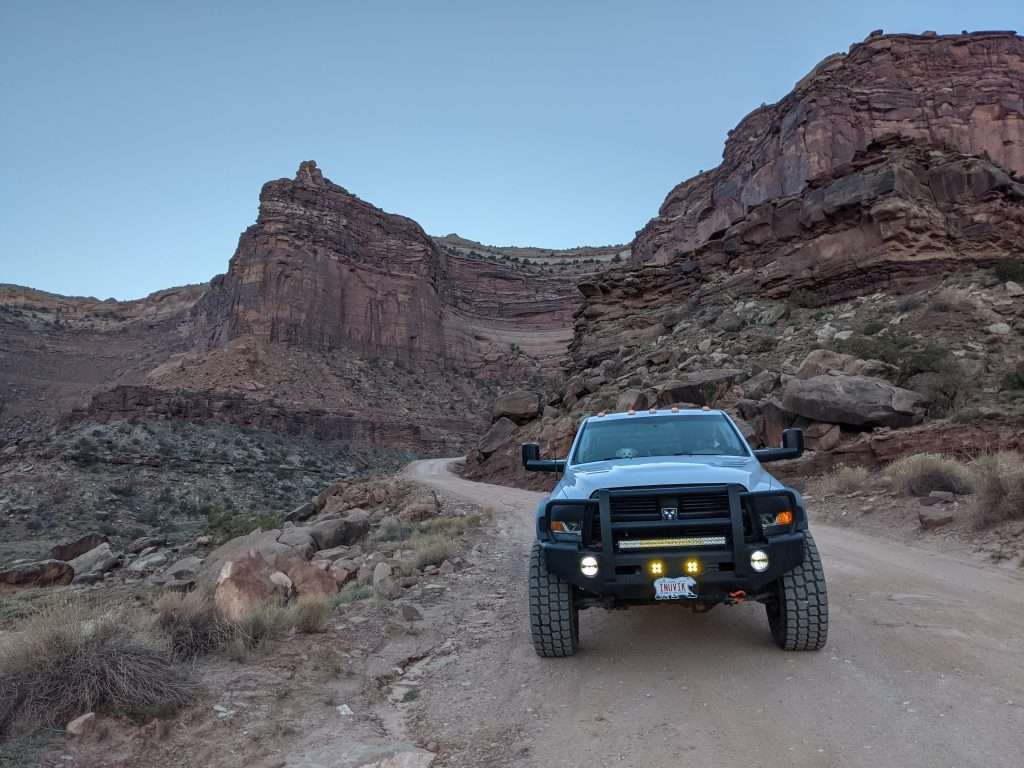 Truck driving through desert rocks