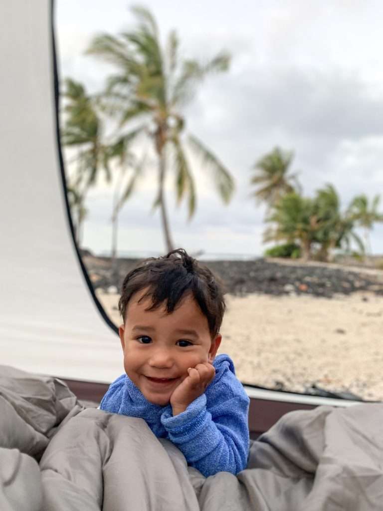 Little boy in tent in Hawaii