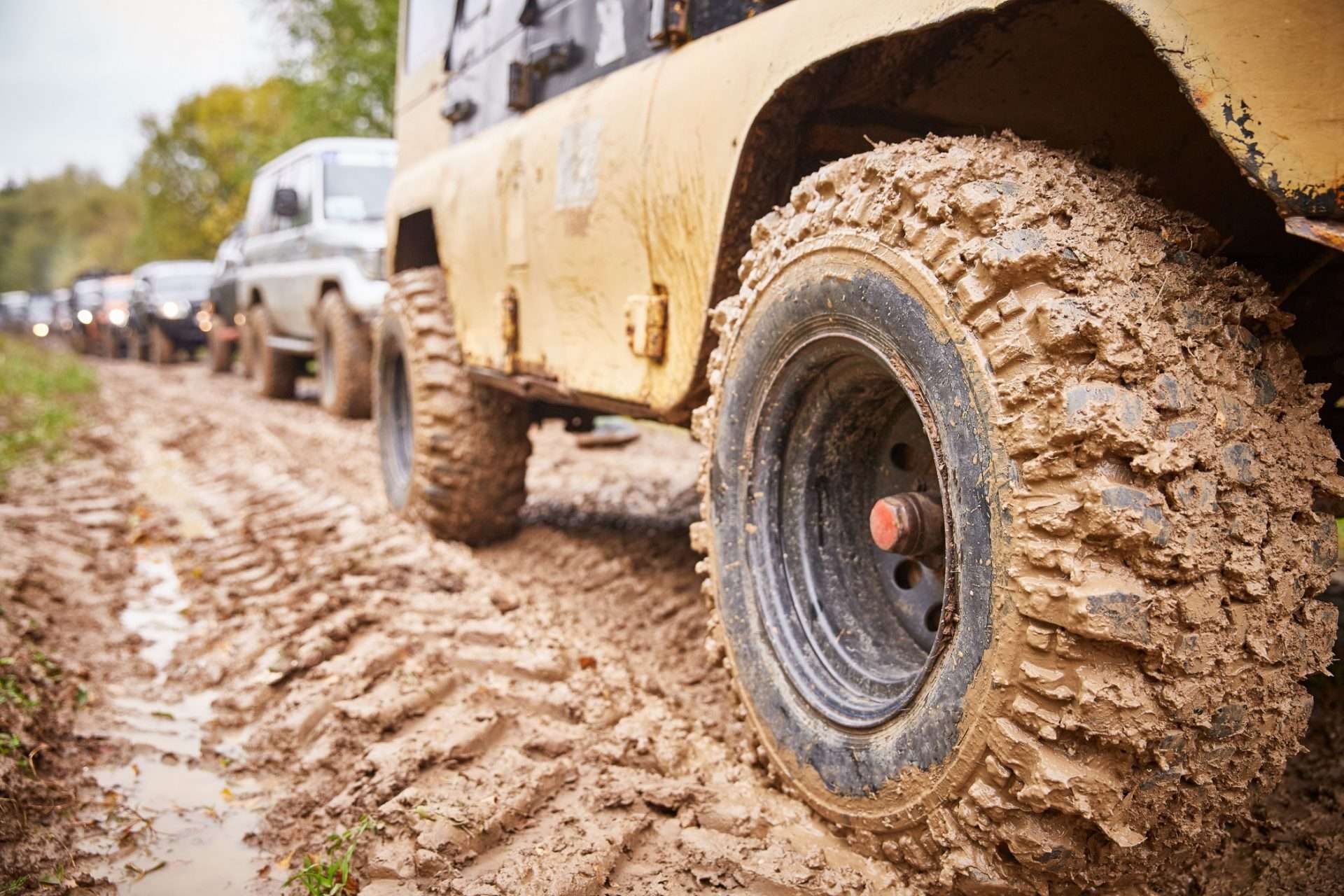 Vehicles off roading through mud.