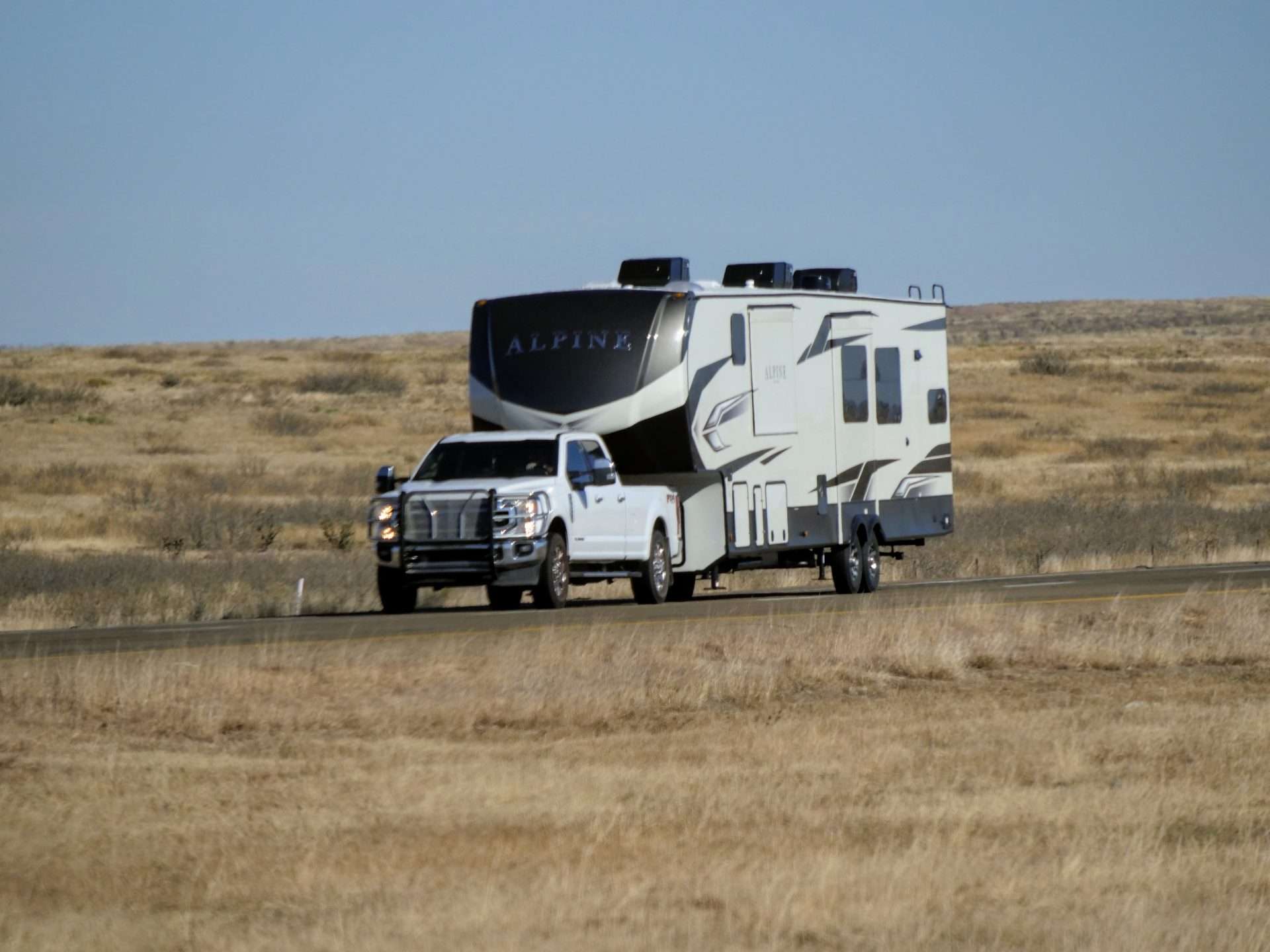 Truck towing RV on highway