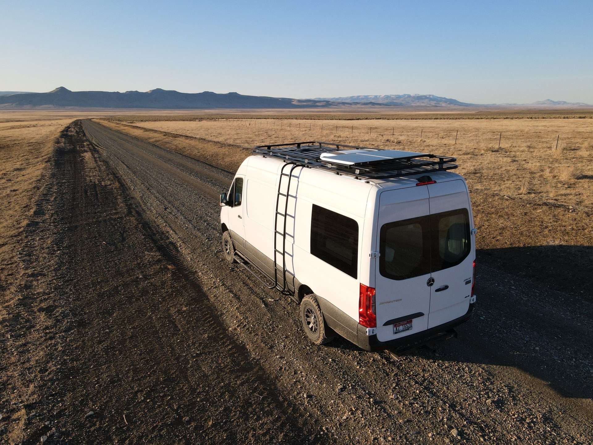 Camper van driving with solar panel on top