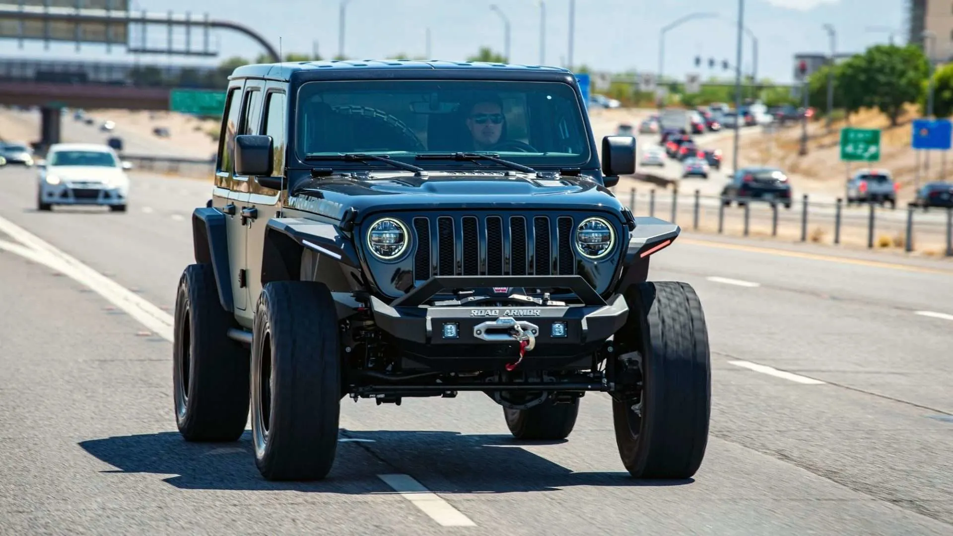 lifted Jeep on highway
