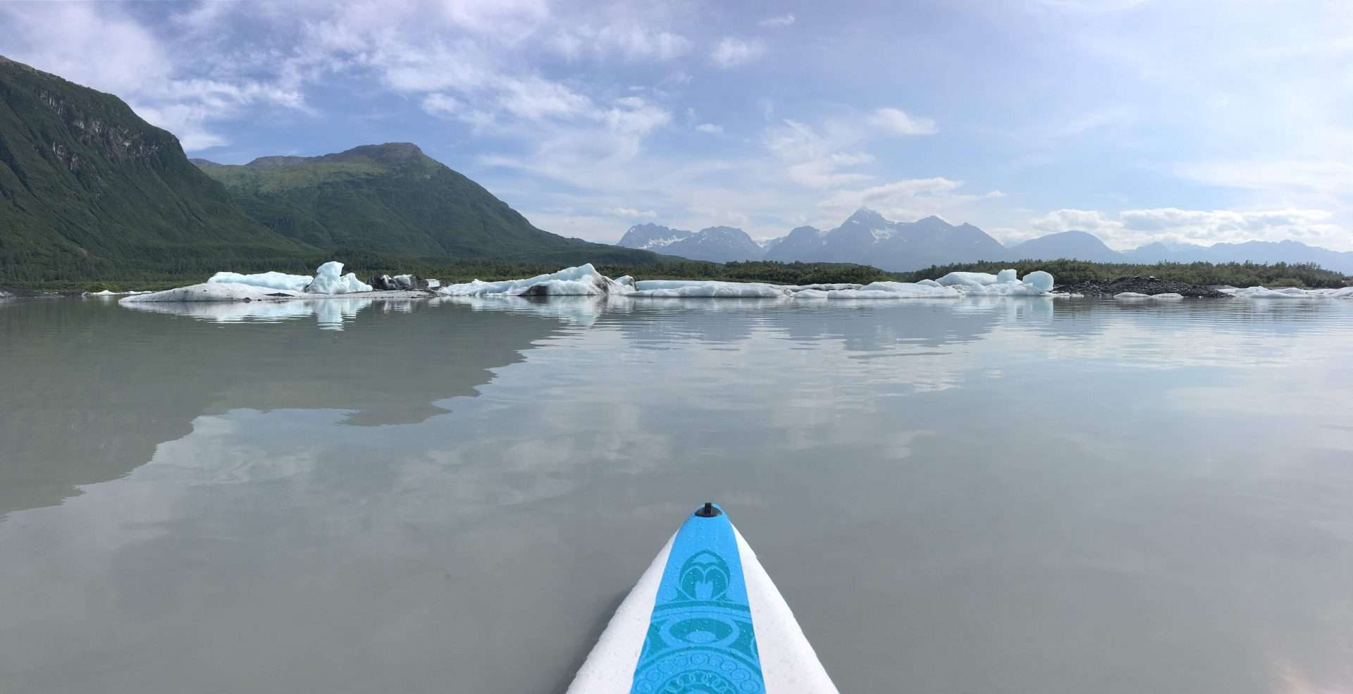 Kayak in front of glaciers