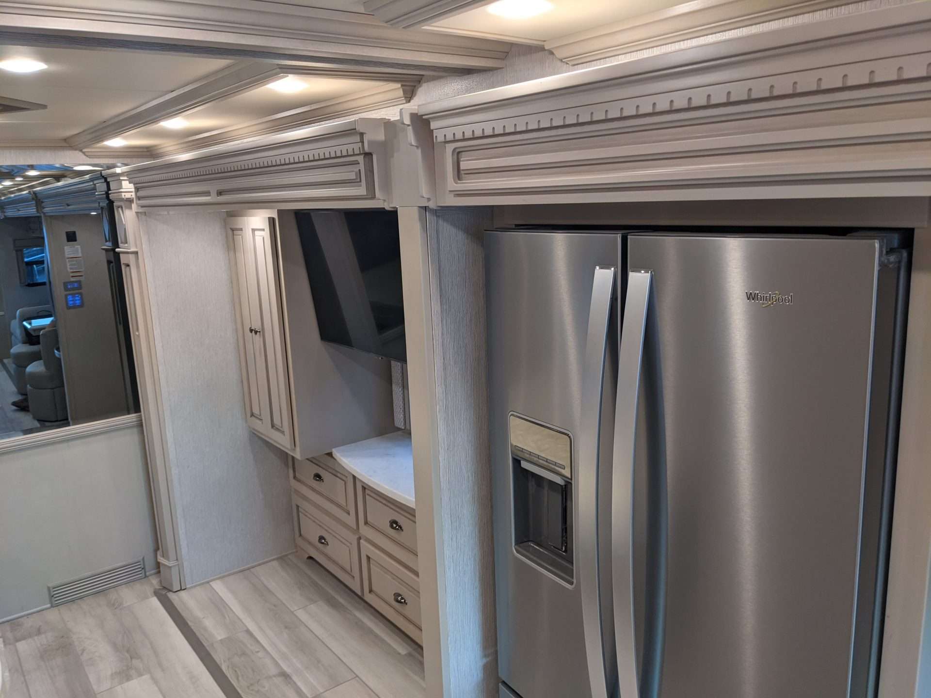 Interior of new RV kitchen with refrigerator. 