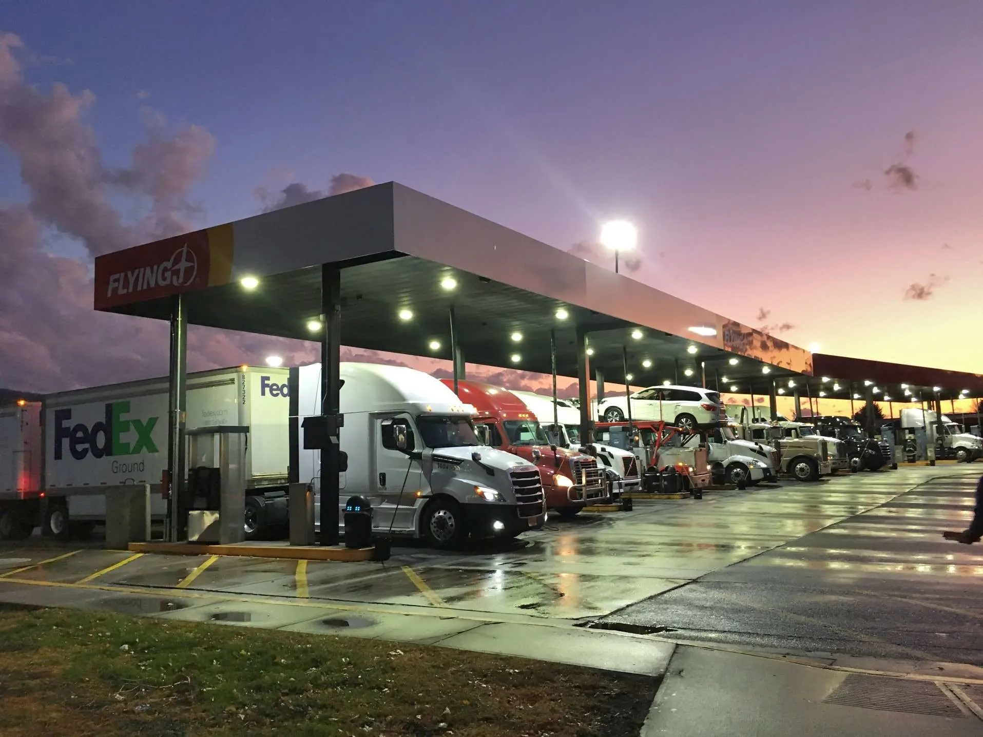 Flying J truck stop with trucks and RVs parked.