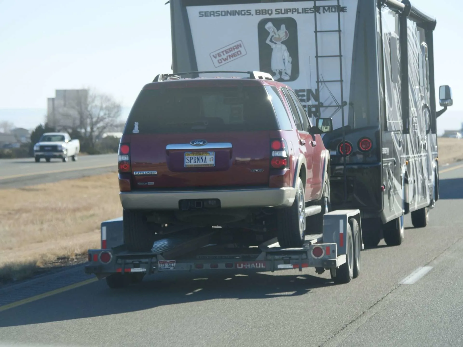 Car being driven on a car hauler trailer