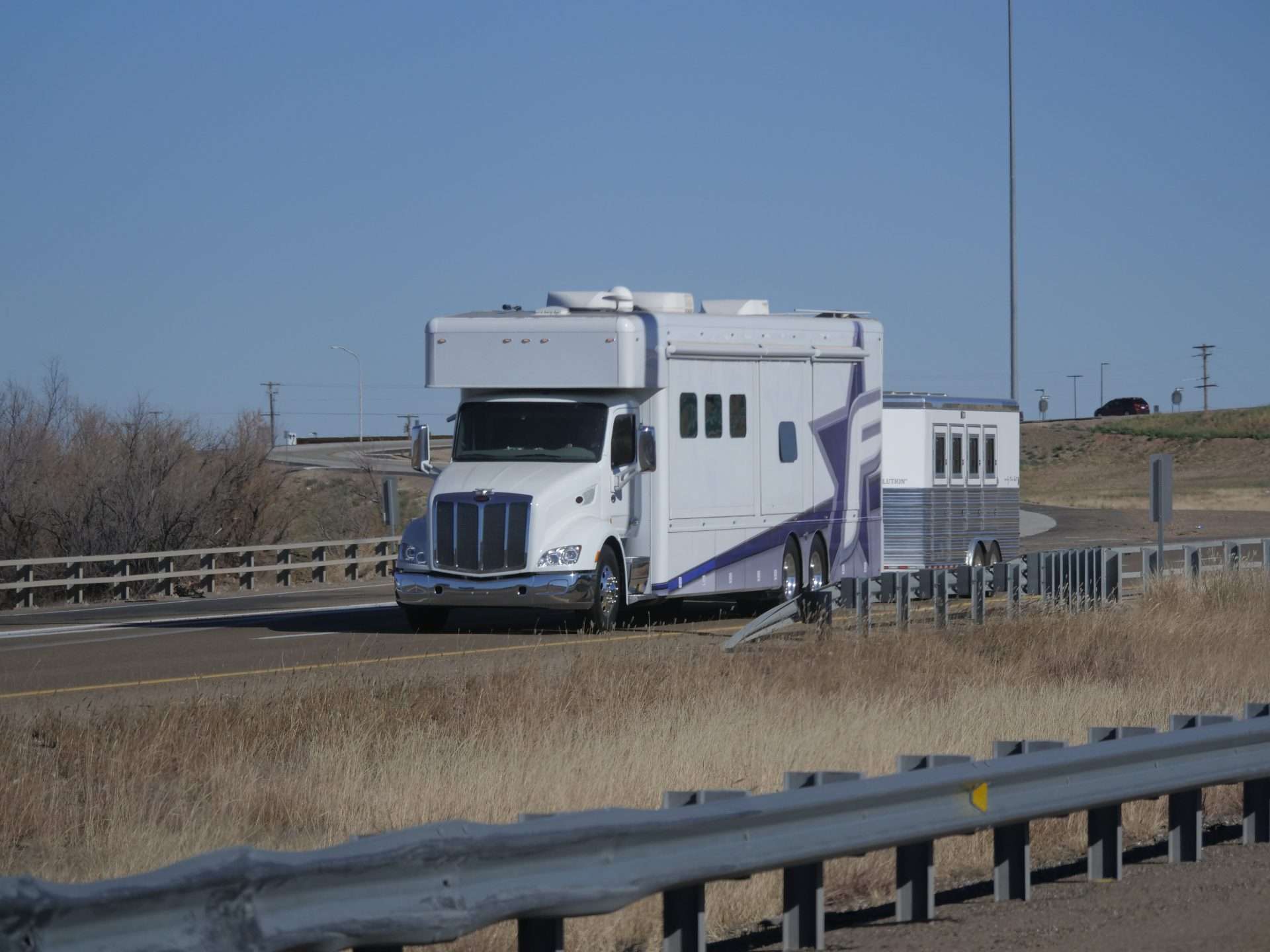 Super C motorhome towing a trailer