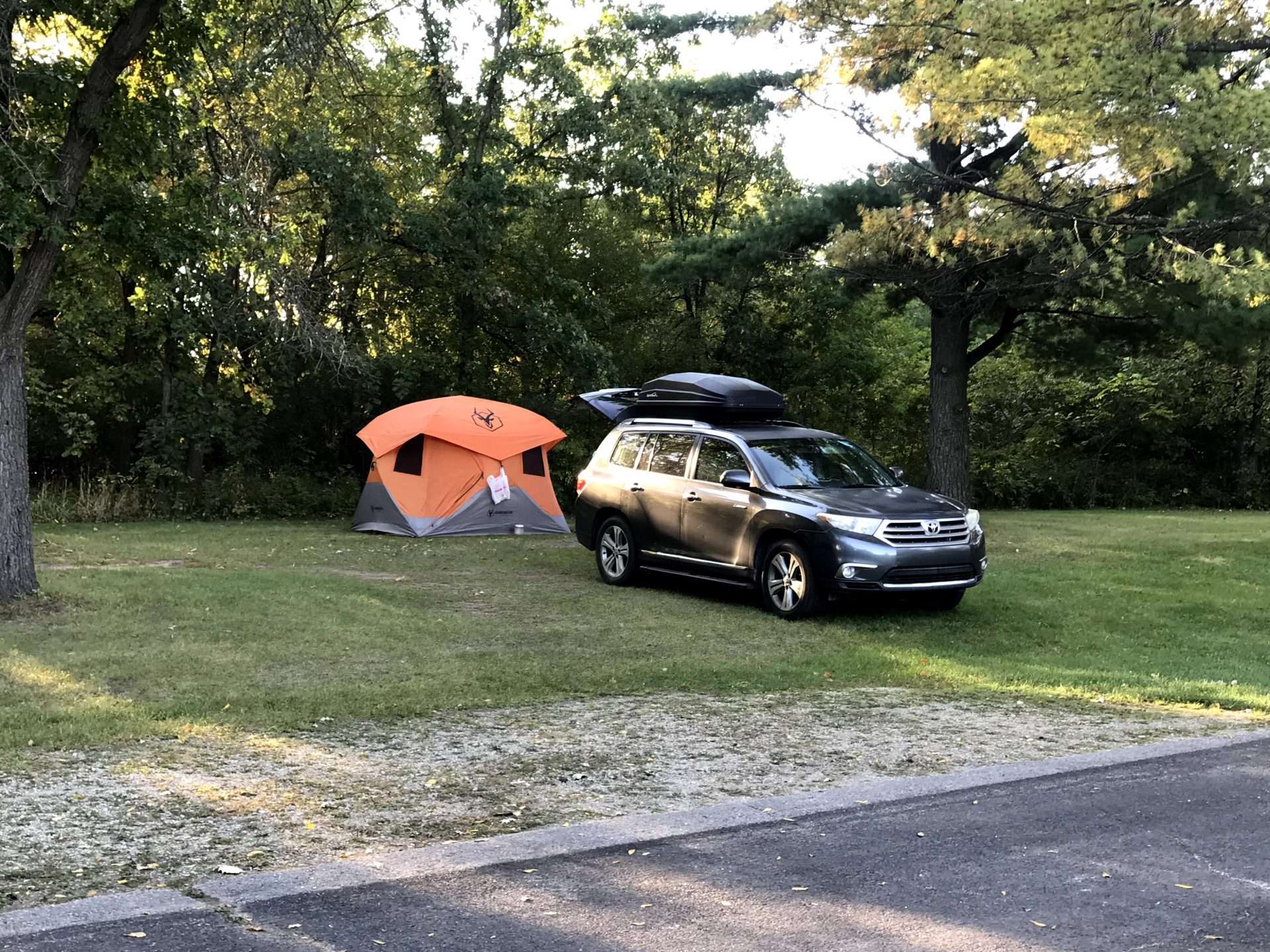 Tent and SUV set up at campsite.
