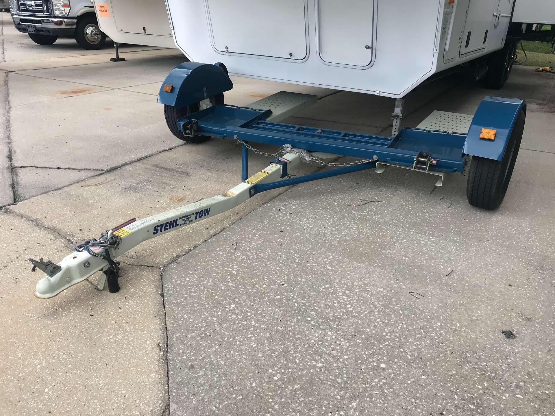 blue and white stehl rv tow dolly