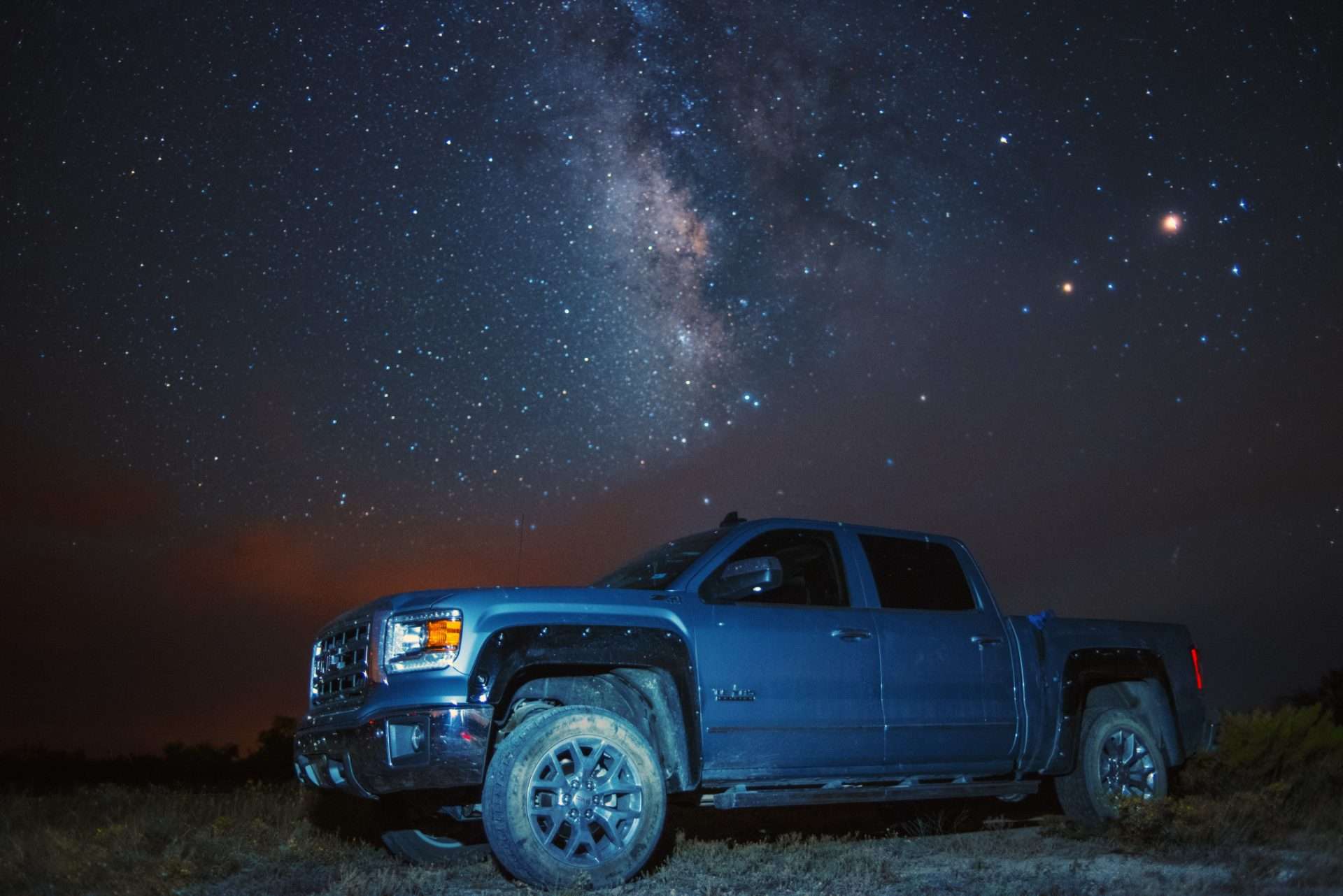 Truck parked under the stars for camping