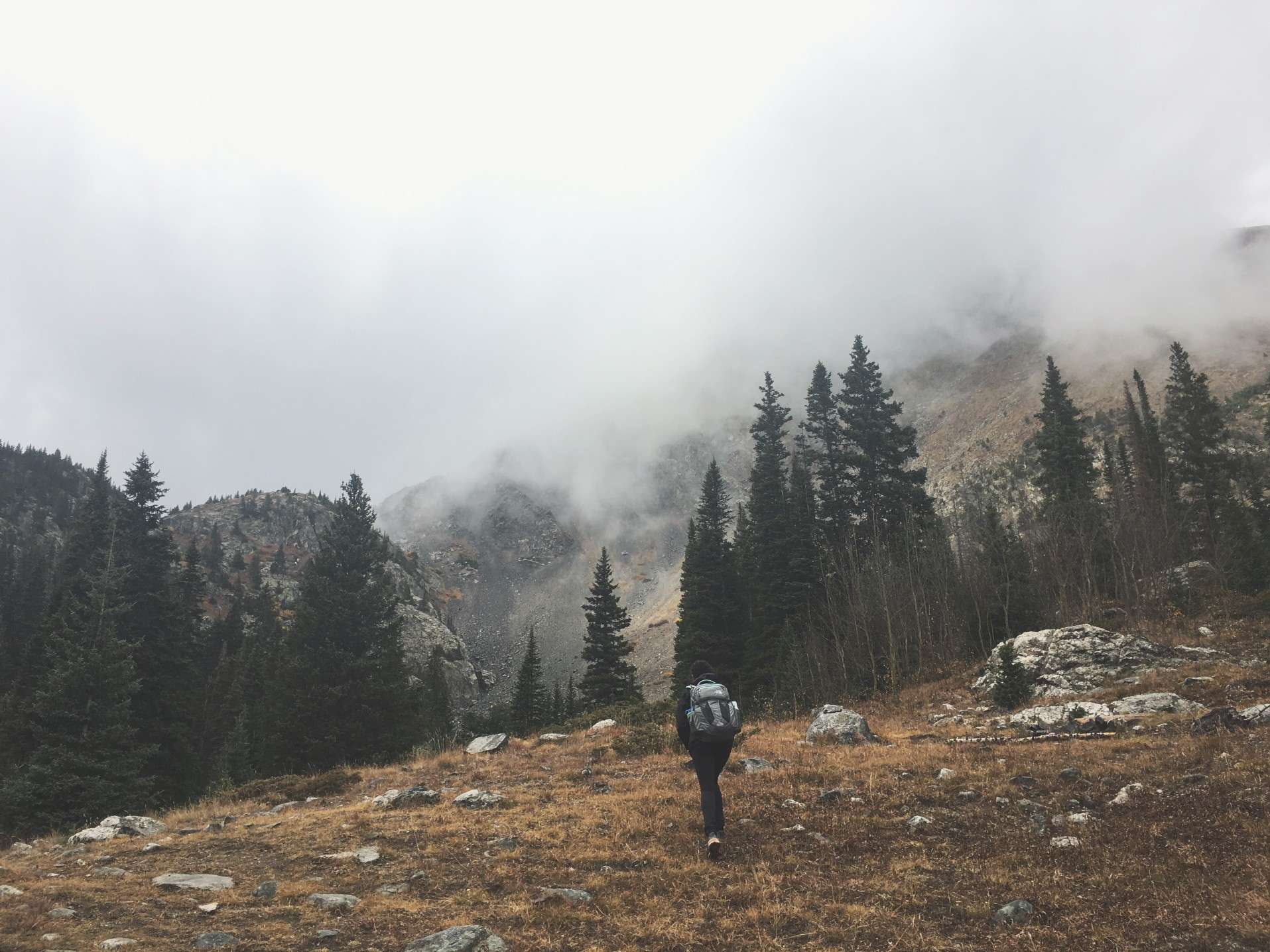 Woman hiking solo in the mountains.