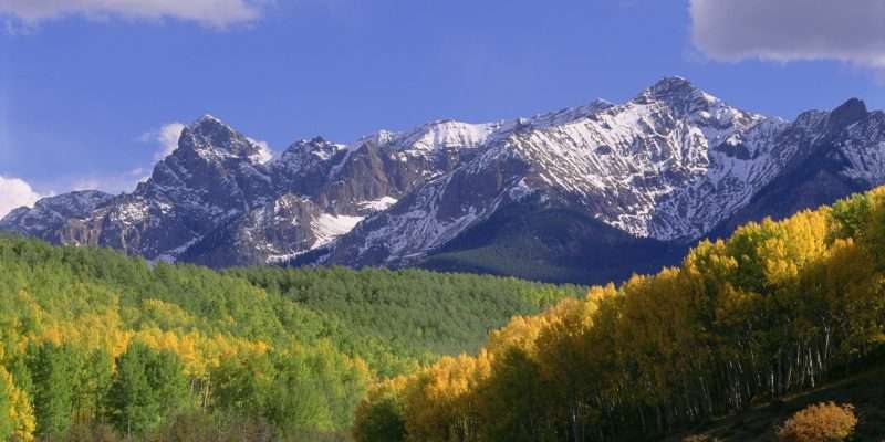 Mount Sneffels in the San Juan Mountains, in Ouray County. Aspen trees in autumn.
