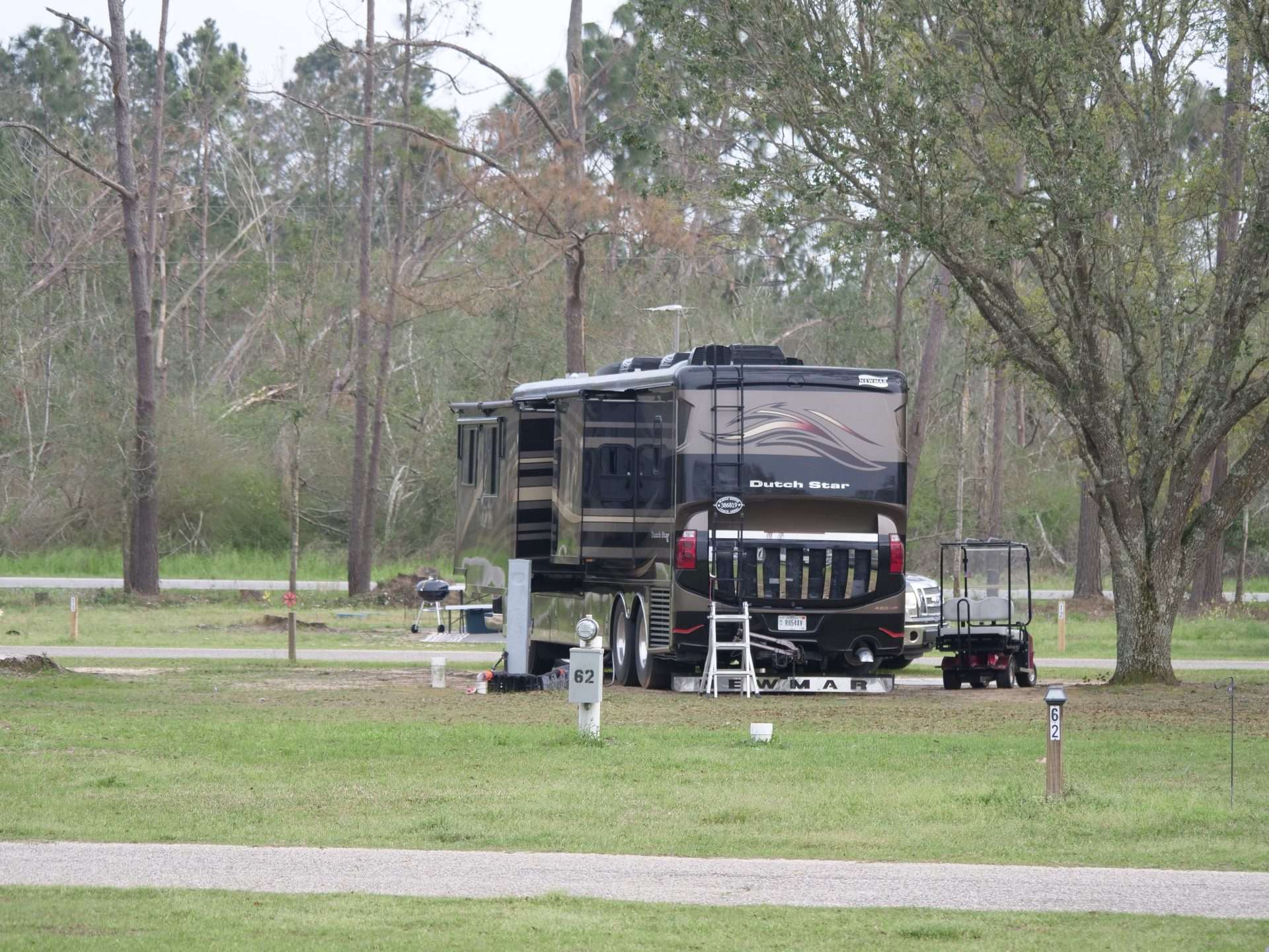 Dutch Star Newmar RV parked at campsite.